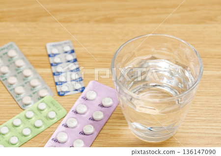 Medicine and a glass of water Medicine and a glass of water 136147090