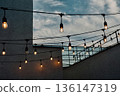 The outdoor terrace's illuminations create a nostalgic film-like landscape. 136147319