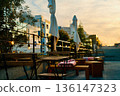 Outdoor terrace seating with blankets on a winter evening 136147323