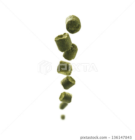 Hop granules showcased vividly. Closeup of hop particles gleaming. Bright studio shot highlighting hopping ingredients for brewing excellence Hop granules showcased vividly. Closeup of hop particles gleaming. Bright studio shot highlighting hopping ingredients for brewing excellence 136147843