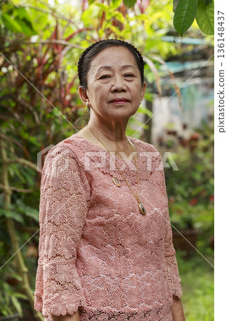 elder woman in garden 136148437