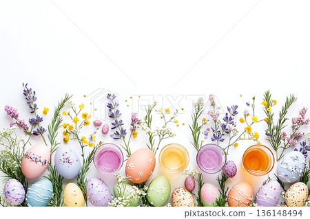Colorful Easter Eggs Surrounded by Flowers and Festive Decor on a White Background 136148494