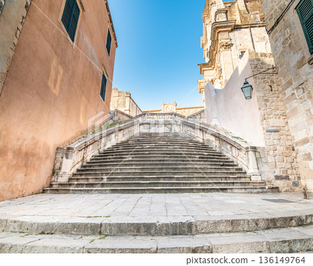 Baroque staircase in Old Town Dubrovnik, the way to Church of St. Ignatius. Famous place for tourist, known as walk of shame. Baroque staircase in Old Town Dubrovnik, the way to Church of St. Ignatius. Famous place for tourist, known as walk of shame. 136149764