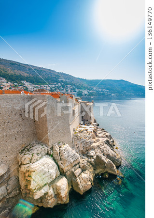 Old city Dubrovnik, Croatia.View of historic city wall above the cliff and adriatic sea. Old city Dubrovnik, Croatia.View of historic city wall above the cliff and adriatic sea. 136149770
