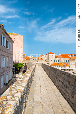 Ancient stone wall of Dubrovnik Old Town, stunning fortification system. The world famous and most visited historic city of Croatia, UNESCO World Heritage site 136149776