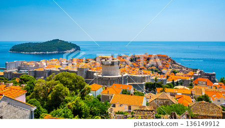Panorama cityscape view of old town Dubronik. Famous ancient city with big city walls and beautiful architecture is great tourist destination in Croatia.Old city of Dubrovnik is part of UNESCO 136149912