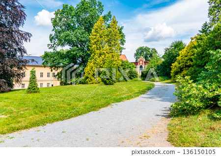 Park and Castle Cechy pod Kosirem, Moravia, Czech Republic. Chateau built in empire style. Outdoors view from public park. 136150105