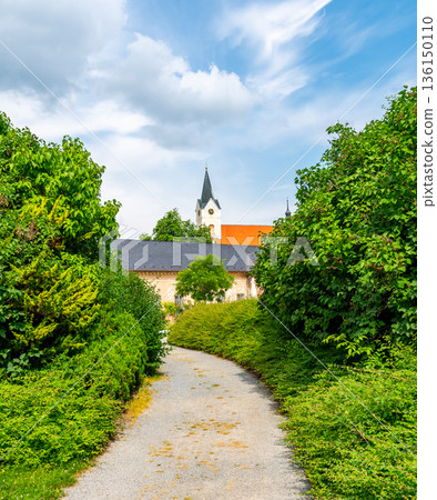 Park and Castle Cechy pod Kosirem, Moravia, Czech Republic. Chateau built in empire style. Outdoors view from public park. 136150110