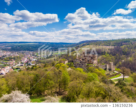 Aerial drone panorama view of medieval castle Boskovice. Ruin of ancient stronghold placed at hill in South Moravia region, Czech Republic. Summer day with blue sky. 136150236