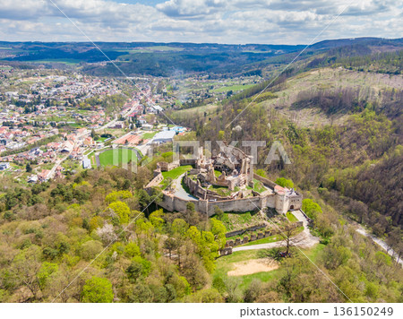 Aerial drone panorama view of medieval castle Boskovice. Ruin of ancient stronghold placed at hill in South Moravia region, Czech Republic. Summer day with blue sky. 136150249