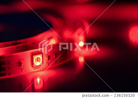 Red led strip lights illuminating electronic circuit board Red led strip lights illuminating electronic circuit board 136150320