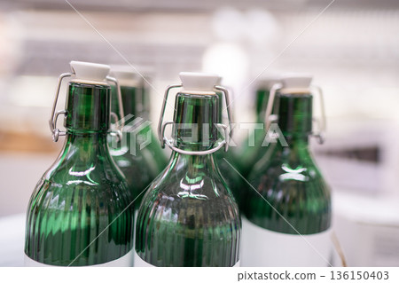 Green glass bottles with swing top seals Green glass bottles with swing top seals 136150403