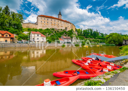Panoramic view of castle above river in Ledec nad Sazavou. Sazava river is famous target for kayaking. Summer weather with dramatic clouds. Czech Republic. 136150450