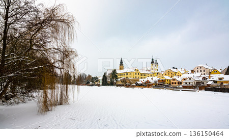 View of Telc castle in winter, during snowfalling. Historical building is part of UNESCO heritage. Czech Republic. 136150464