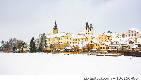 View of Telc castle in winter, during snowfalling. Historical building is part of UNESCO heritage. Czech Republic. View of Telc castle in winter, during snowfalling. Historical building is part of UNESCO heritage. Czech Republic. 136150466