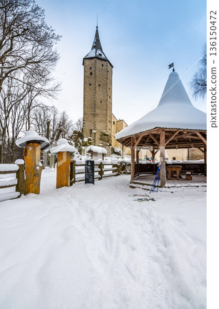 Medieval castle Rostejn in winter during snowfalling. Castle is placed in deep forest near Telc city. Winter and snow, beautiful nature. 136150472