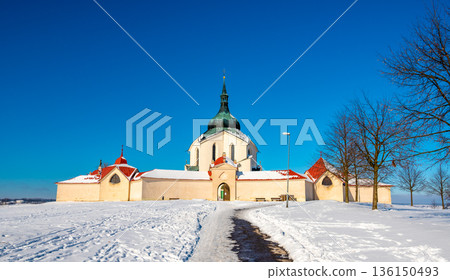 The Pilgrim Church of St. John of Nepomuk on Zelena Hora - Green Mountain, Zdar nad Sazavou, Czech Republic, UNESCO heritage. Winter weather with snow. Sunny frozen day. The Pilgrim Church of St. John of Nepomuk on Zelena Hora - Green Mountain, Zdar nad Sazavou, Czech Republic, UNESCO heritage. Winter weather with snow. Sunny frozen day. 136150493
