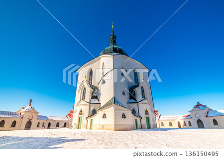 The Pilgrim Church of St. John of Nepomuk on Zelena Hora - Green Mountain, Zdar nad Sazavou, Czech Republic, UNESCO heritage. Winter weather with snow. Sunny frozen day. The Pilgrim Church of St. John of Nepomuk on Zelena Hora - Green Mountain, Zdar nad Sazavou, Czech Republic, UNESCO heritage. Winter weather with snow. Sunny frozen day. 136150495