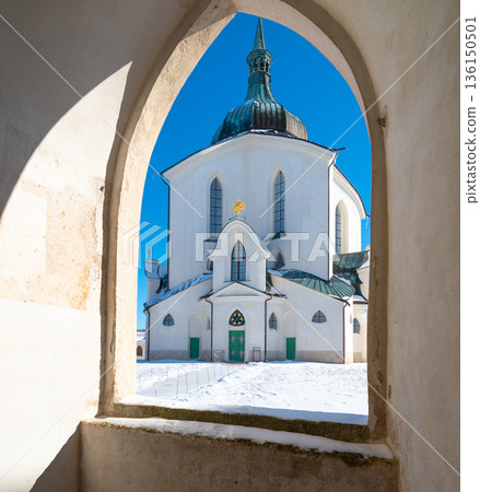 The Pilgrim Church of St. John of Nepomuk on Zelena Hora - Green Mountain, Zdar nad Sazavou, Czech Republic, UNESCO heritage. Winter weather with snow. Sunny frozen day. The Pilgrim Church of St. John of Nepomuk on Zelena Hora - Green Mountain, Zdar nad Sazavou, Czech Republic, UNESCO heritage. Winter weather with snow. Sunny frozen day. 136150501