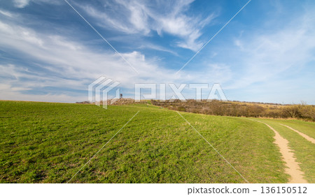 Lookout tower near Hustopece city, placed in blooming almond tree orchard. South Moravia region, Czech Republic. Spring weather during sunset. 136150512