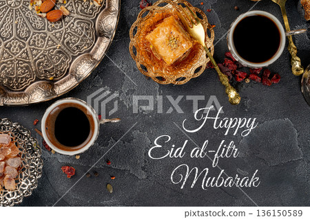 Celebration of Eid al-Fitr with coffee, sweets, and traditional treats on a serving table Celebration of Eid al-Fitr with coffee, sweets, and traditional treats on a serving table 136150589
