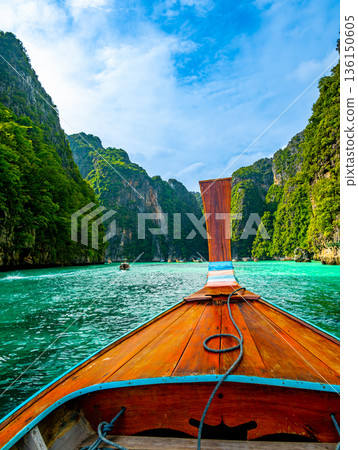 View of Pi Leh lagoon (also known as Green Lagoon) at Ko Phi Phi islands, Thailand. View from typical long tailed boat. Typical Thai picture of tropical paradise. Limestone rock and turquoise water. 136150605