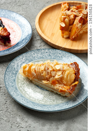 Delicious dessert served on patterned plates in a casual dining setting 136150828