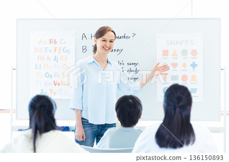 Education English conversation class Native teacher giving lesson 136150893