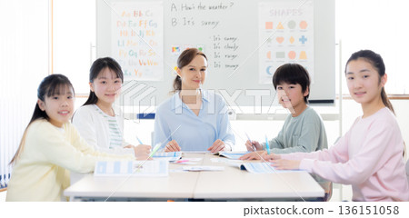 Education: Portrait of a child taking a lesson in an English conversation class and a native teacher 136151058