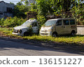 Abandoned vans overgrown with vegetation parked on roadside for decay and environmental reclamation concept Abandoned vans overgrown with vegetation parked on roadside for decay and environmental reclamation concept 136151227