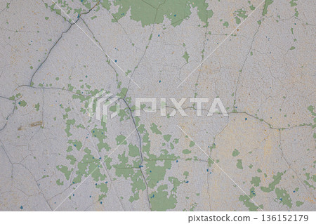 light green concrete wall texture.Texture of cracks on the wall. Old shabby wall. Texture peeling paint. 136152179