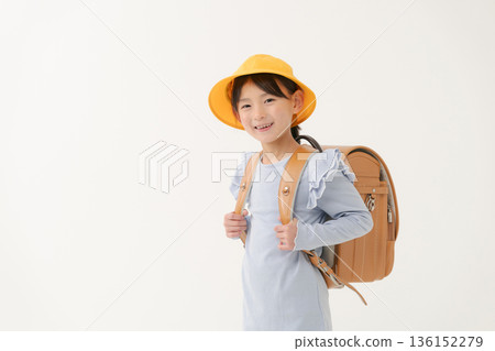 Girls carrying a school bag Girls carrying a school bag 136152279