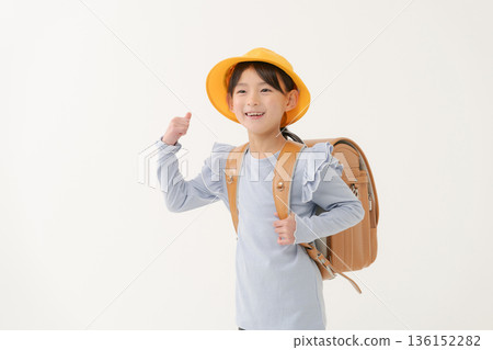 Girls carrying a school bag Girls carrying a school bag 136152282