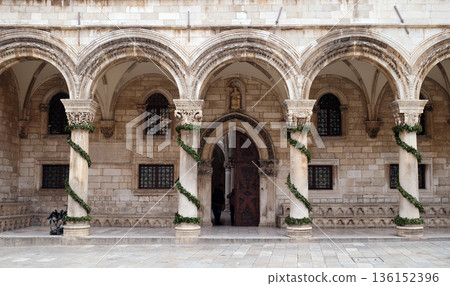 Columns and exterior of the Duke's Palace (Knezev dvor) decorated with Advent wreaths in Dubrovnik, Croatia 136152396