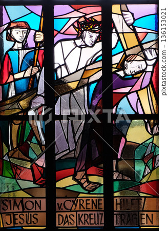 5th Stations of the Cross, Simon of Cyrene carries the cross, stained glass window in Saint Lawrence church in Kleinostheim, Germany 136153021