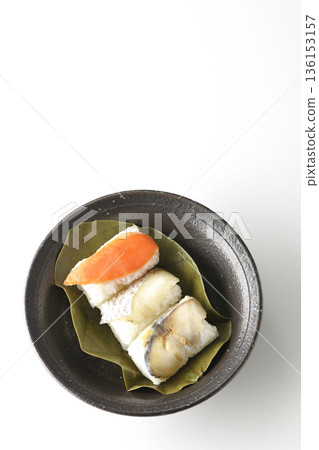 Salmon, sea bream and mackerel persimmon leaf sushi photographed on a white background Salmon, sea bream and mackerel persimmon leaf sushi photographed on a white background 136153157