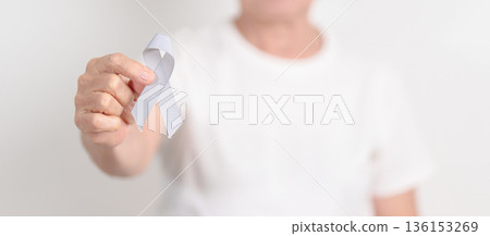 Elderly with Gray ribbon for May Brain Cancer Awareness month and Asthma Awareness, Support life people Survivor. Healthcare and February World cancer day Elderly with Gray ribbon for May Brain Cancer Awareness month and Asthma Awareness, Support life people Survivor. Healthcare and February World cancer day 136153269