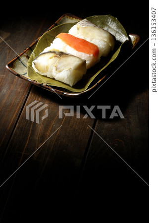 Salmon, sea bream and mackerel sushi wrapped in persimmon leaves Salmon, sea bream and mackerel sushi wrapped in persimmon leaves 136153407