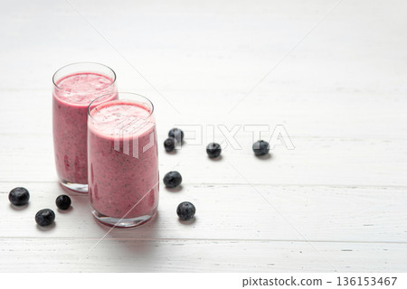 Two glasses of berry smoothie with chia and fresh berries Two glasses of berry smoothie with chia and fresh berries 136153467