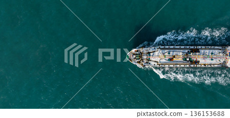 Aerial view oil tanker ship on sea, Oil tanker ship top view, Logistic and maritime transportation of petroleum petrochemical supply chain, Oil tanker ship traveling sailing the sea. Aerial view oil tanker ship on sea, Oil tanker ship top view, Logistic and maritime transportation of petroleum petrochemical supply chain, Oil tanker ship traveling sailing the sea. 136153688
