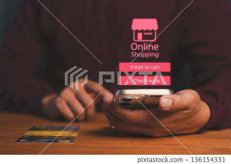 Person holding a smartphone with digital icons displaying Online Shopping, Add to Cart, and Check Out, representing mobile ecommerce, digital purchasing, and modern online retail experiences. Person holding a smartphone with digital icons displaying Online Shopping, Add to Cart, and Check Out, representing mobile ecommerce, digital purchasing, and modern online retail experiences. 136154331