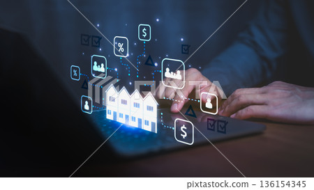 Businessman using laptop with digital real estate icons, showing property investment, mortgage rate, housing data, rent, and financial analytics concept in smart technology and real estate market. 136154345