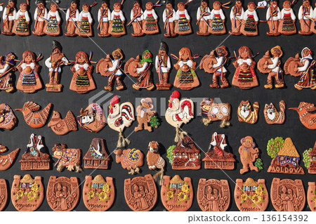 Moldavian handmade souvenir magnets in a souvenir shop. 136154392