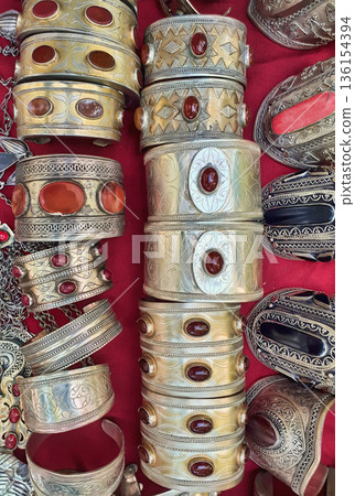 National woman jewelry made of silver and semi-precious stones. Turkmenistan. Ashkhabad market. 136154394