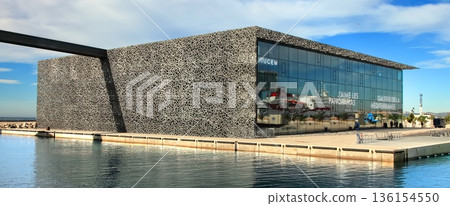 Marseille, France - November 19, 2017 : The modern building of Museum of European and Mediterranean Civilizations (MuCEM). It was inaugurated on 2013 when the city was the European Capital of Culture Marseille, France - November 19, 2017 : The modern building of Museum of European and Mediterranean Civilizations (MuCEM). It was inaugurated on 2013 when the city was the European Capital of Culture 136154550