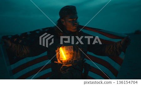 US Military Near the Ocean at Night With the American Flag Waving For memorial 136154704