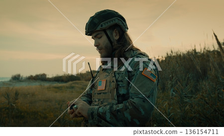 American soldier ready for war attack on a beach American soldier ready for war attack on a beach 136154711