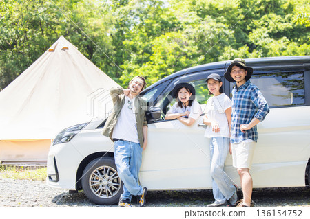 Families enjoying camping 136154752