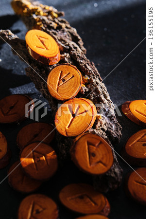 handmade wooden runes close-up on dark background handmade wooden runes close-up on dark background 136155196