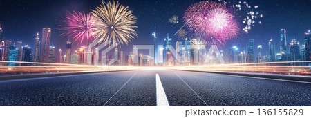 Colorful fireworks exploding over illuminated dubai skyline at night with light trails on the road leading to the city celebrating new year's eve or national day 136155829